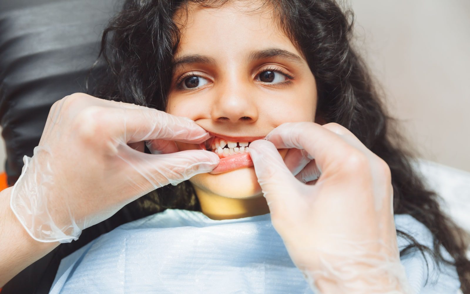 Child Getting Dental Inspection From Dentist